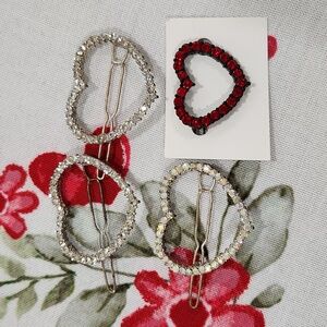 Beautiful, older heart barrettes. 3 larger and one red small.